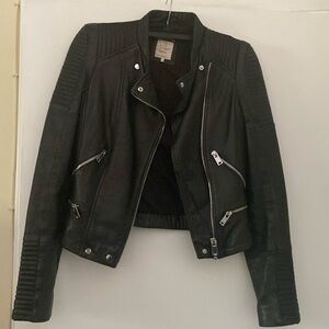 Women leather jacket with lots of pockets and zippers